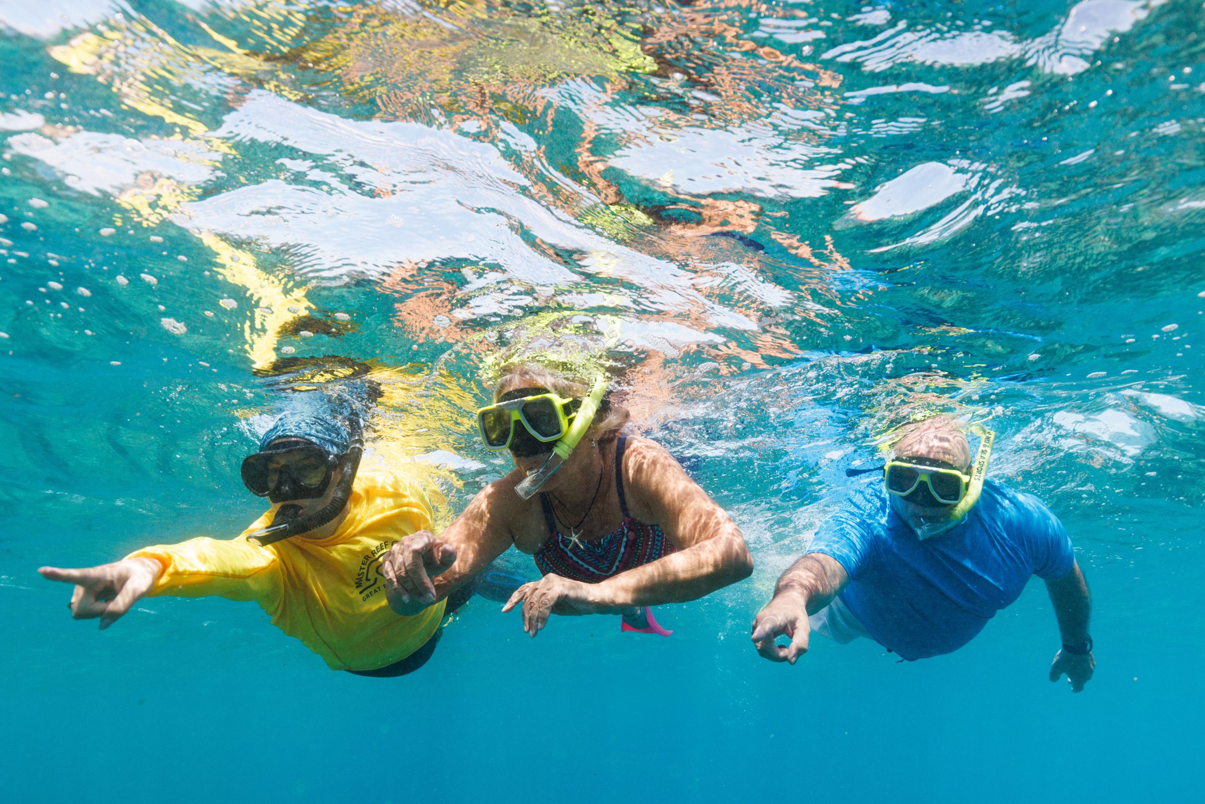 Jessica snorkelling with guests on the reef